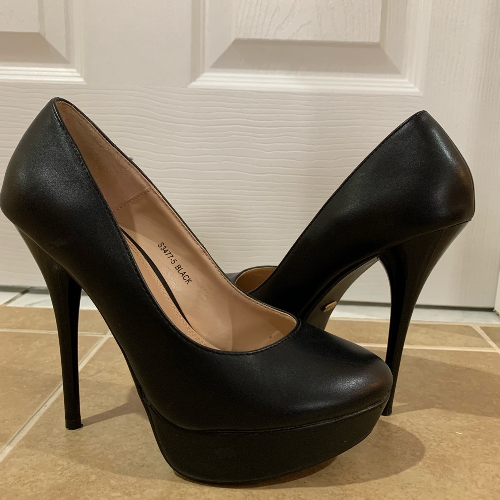 Black platform high heels.